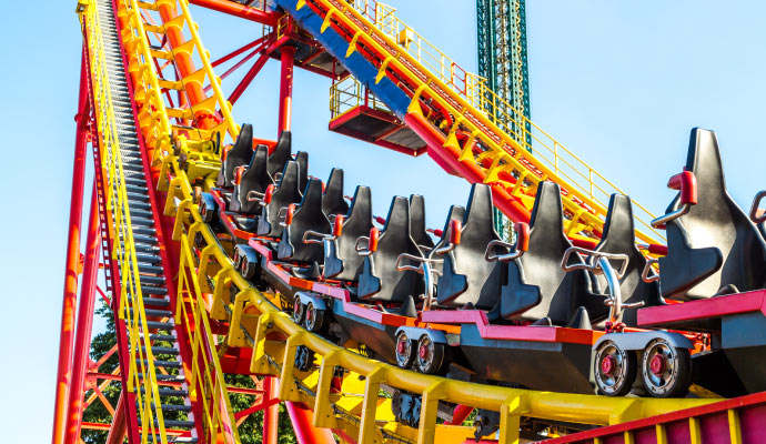 a worker painting roller coaster