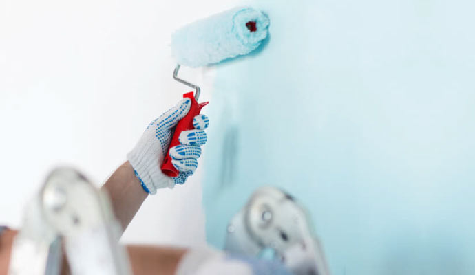 a painter painting an interior