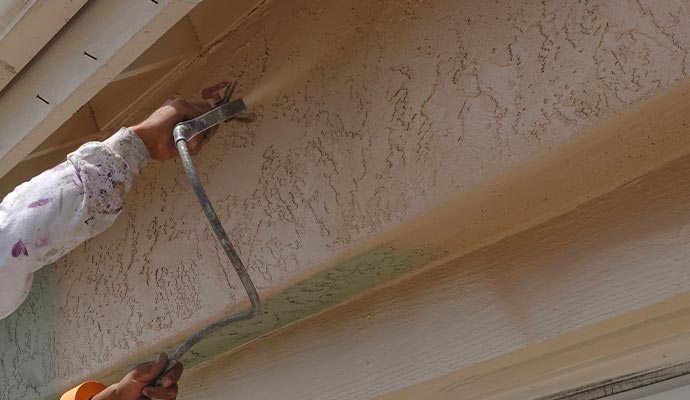Professional painting of commercial stucco surfaces.