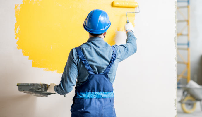 A professional painting an interior