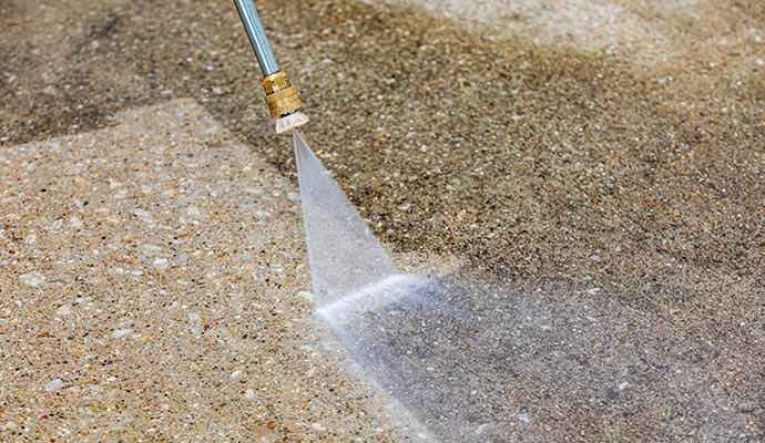 Power washing on concrete surface